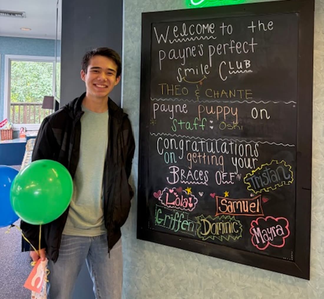 A Payne Orthodontics patient celebrating braces-off day